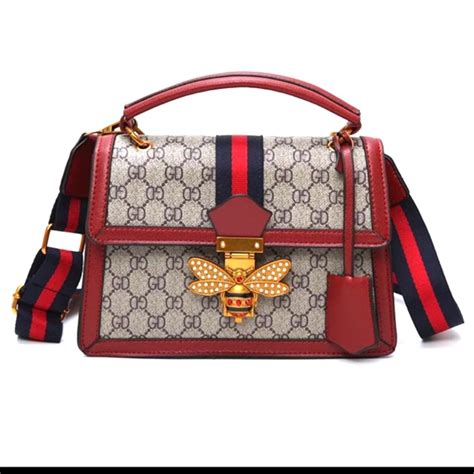 gucci bag with butterfly buckle.